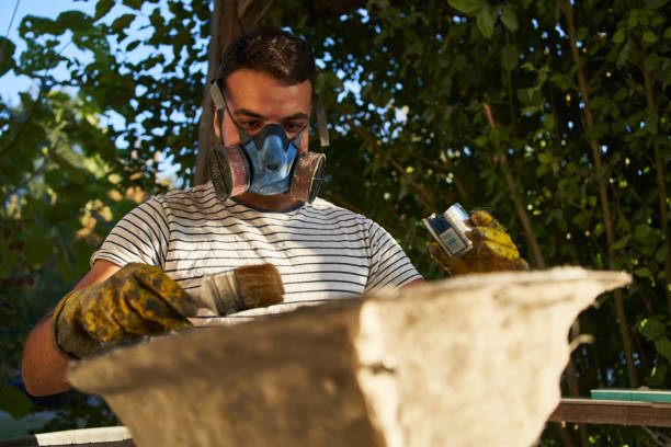 istock Repairman making isolation from varnish so the sink can be better quality 1282723340