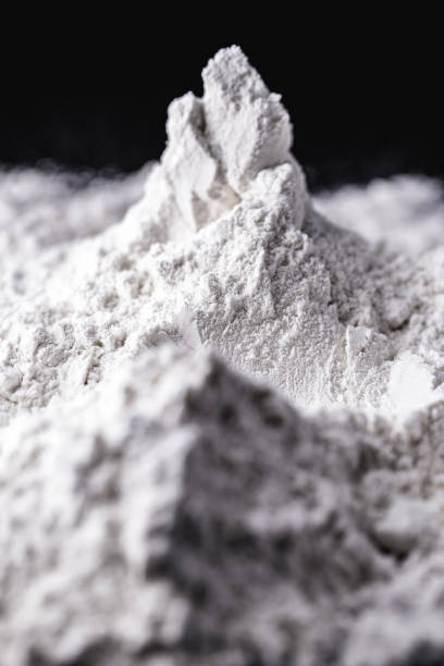 Titanium dioxide (TiO2) powder for cosmetics, isolated black background