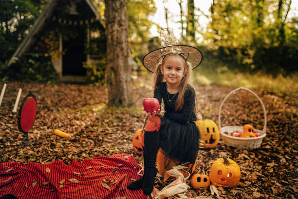 istock Little girls dressed as witch at Halloween 1282729965