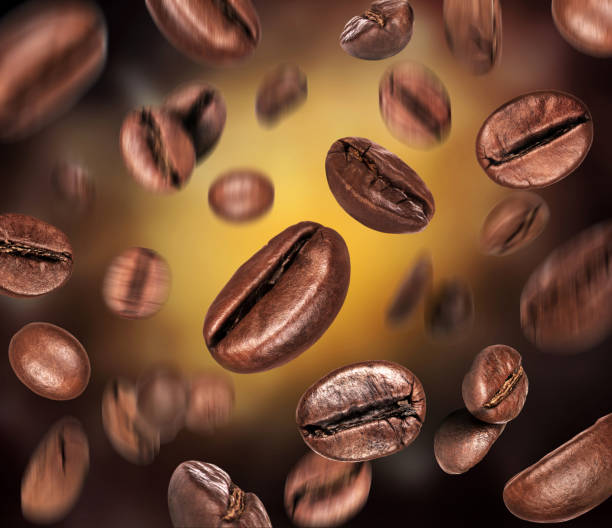istock Coffee beans in a chaotic position in space in the dark 1282734098