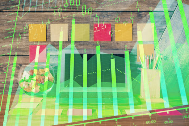 istock Double exposure of forex graph and work space with computer. Concept of international online trading. 1282734194