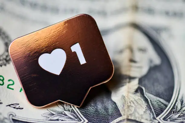 Photo of Like heart symbol on dollar