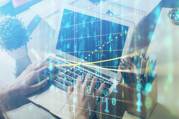 istock Multi exposure of technology hologram with man working on computer background. Concept of big data. 1282734675