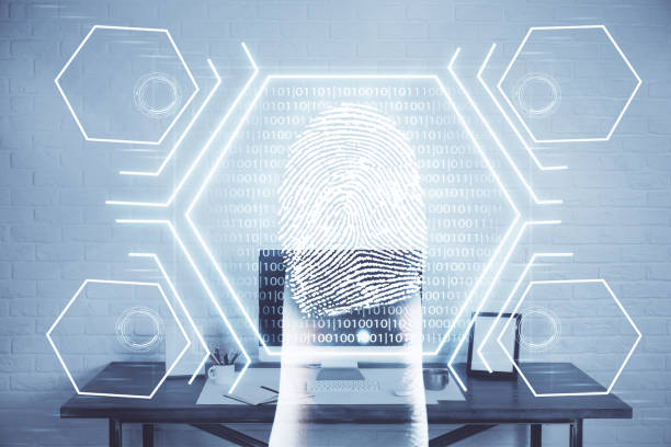 istock Computer on desktop in office with finger print drawing. Double exposure. Concept of business data security. 1282735449