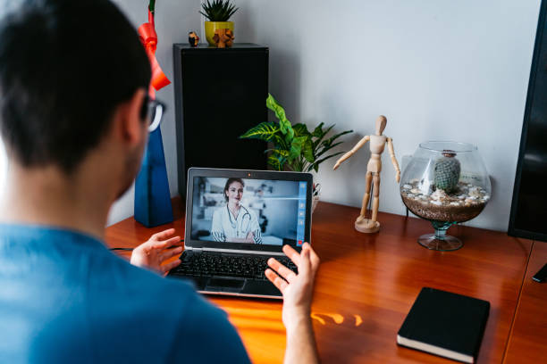 istock Practicing physician having online meeting with a patient 1282735834
