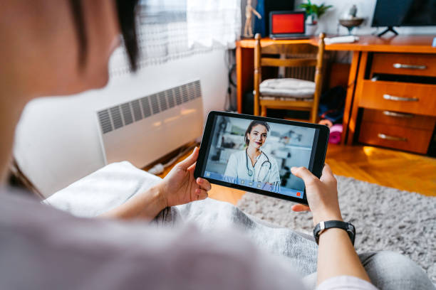 istock Practicing physician having online meeting with a patient 1282735910