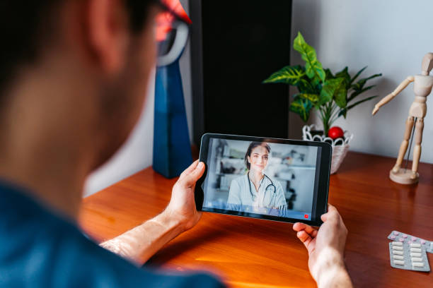 istock Practicing physician having online meeting with a patient 1282735942