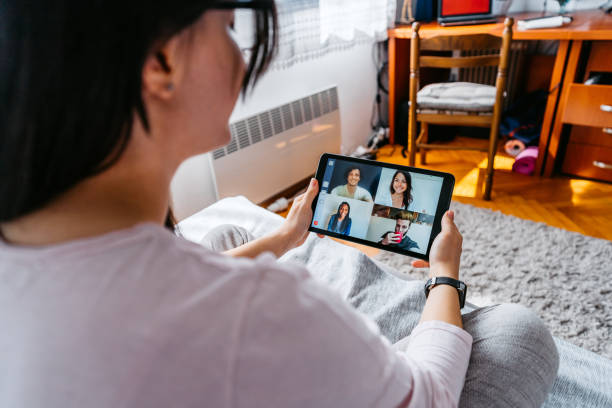 istock Woman having a video call with friends 1282736582