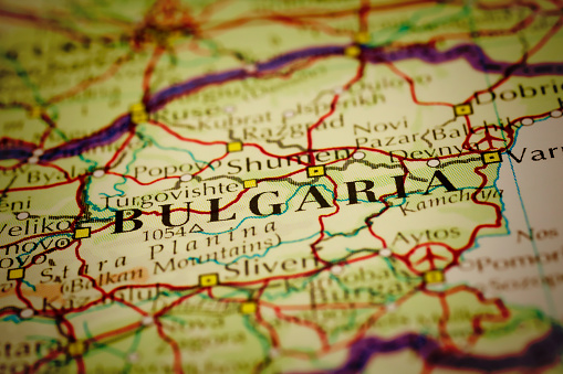 Selective focus and Canon EOS 5D Mark II with MP-E 65mm macro lens. Close-up on Bulgaria on a modern map. Vignette effect and visible offset dots typical for modern printing.