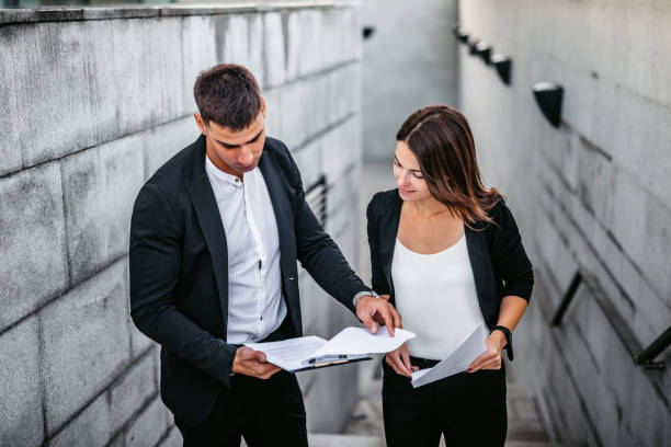 istock Business man and woman discussing work on the go 1282738167