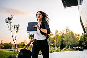 Businesswoman running late in office