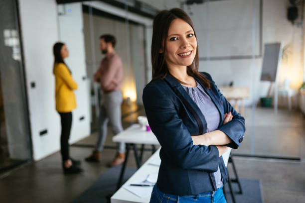 istock Businesswoman standing and looking at camera 1282741593