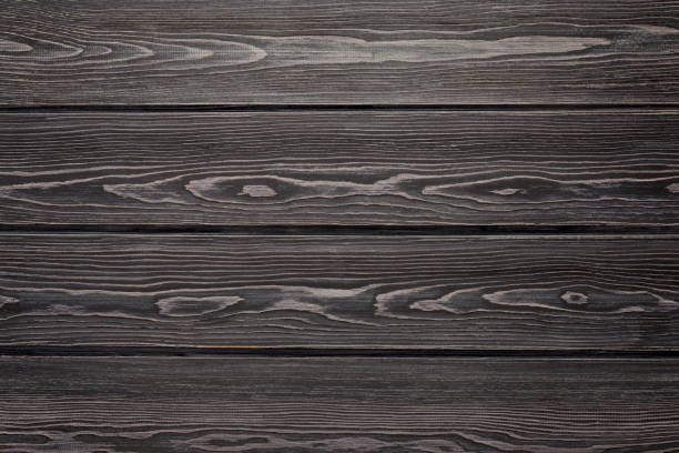 istock Textured wood surface. Natural background from larch boards. Dark color 1282742609