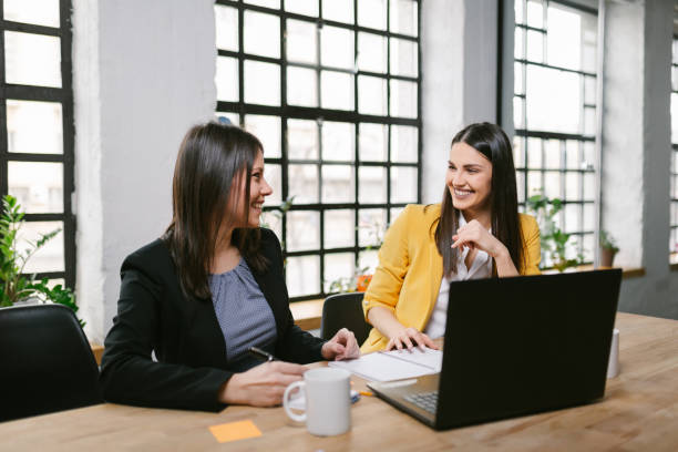 istock Beautiful businesswomen working and smiling 1282743587