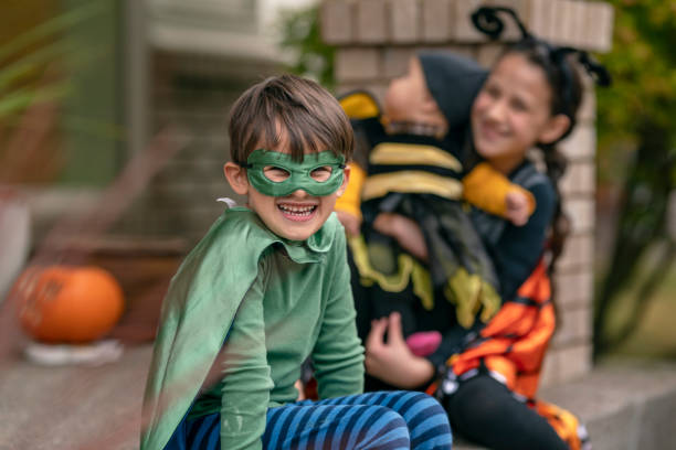 istock Cute boy in superhero costume on Halloween 1282743828