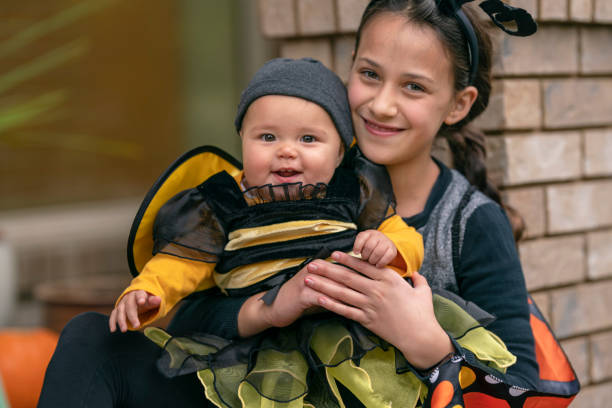 istock Sisters dressed in costumes on Halloween 1282744552