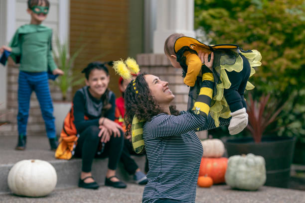 istock Mom playing with baby daughter on Halloween 1282744575