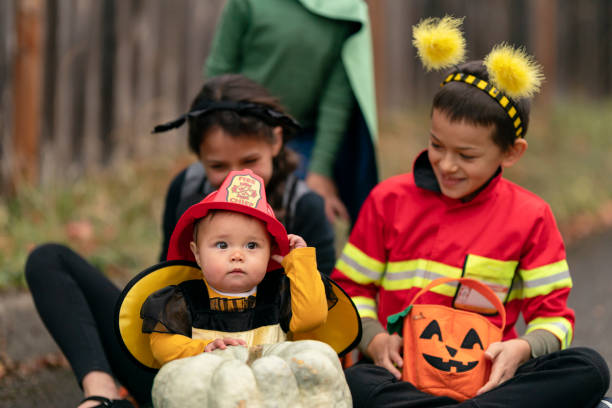 istock Silly siblings trading Halloween costume accessories 1282744629