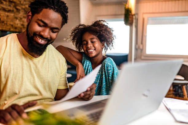 istock Happy father working with his daughter supporting him. 1282746884