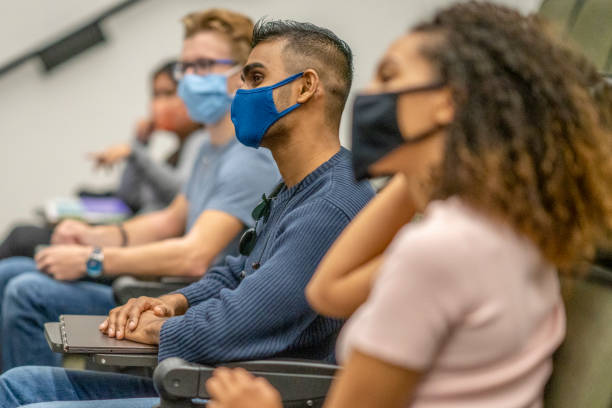 istock University students wearing masks in a lecture hall 1282751544
