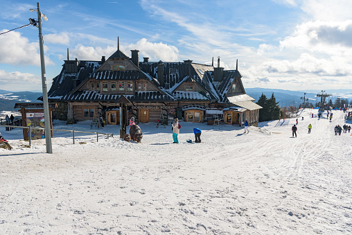 Krynica Zdroj, Poland - January 30, 2020: Tourists and skiers visit the top the Jaworzyna Krynicka mountain at sunny day