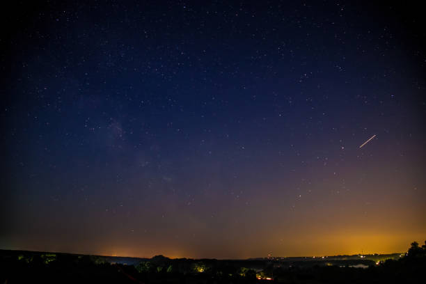 istock Milky Way Galaxy with stars and rural landscape 1282752416