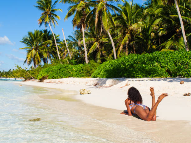 istock Saona beach and beautiful woman on it 1282756140