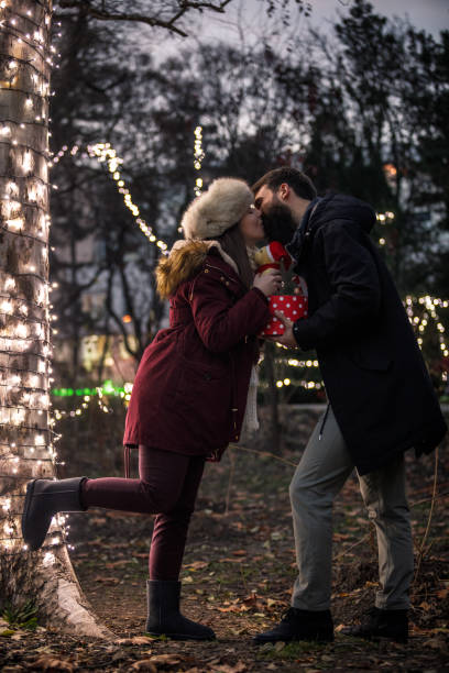 istock Intimate couple enjoying Christmas season 1282756221
