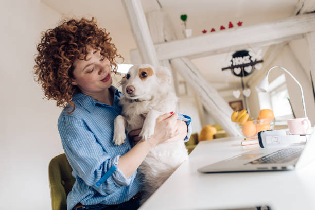 istock Redhead girl enjoying with her puppy 1282756236