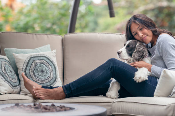 istock Happy Mixed Race Woman Spending Time With Her Dog Outside 1282756401