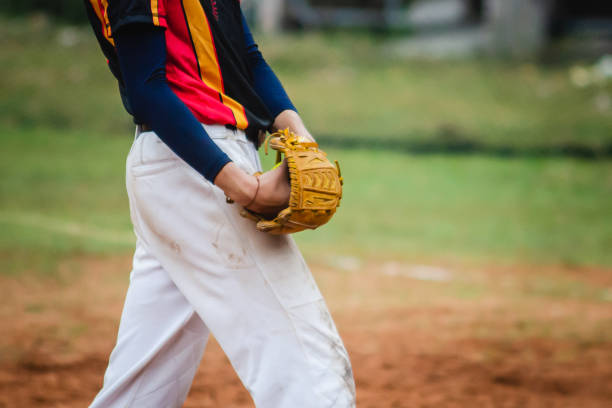 pitcher softball player holding softball in hand ready to throw the ball color - baseball pitcher small sports league imagens e fotografias de stock