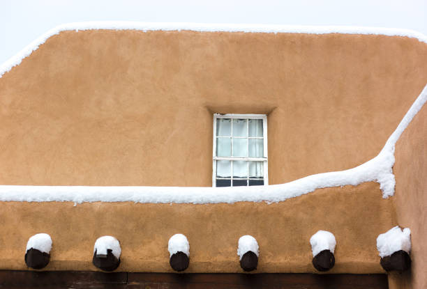 Santa Fe, NM: Adobe Walls in a snowstorm. Copy space available.