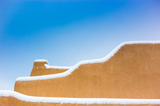 Santa Fe, NM: Adobe Walls in a snowstorm. Copy space available.