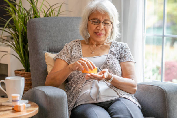 istock Senior woman sitting in her home 1282769430