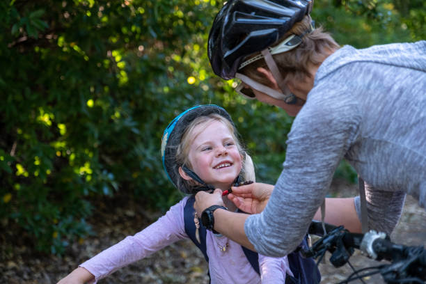 istock Mother and daughter cycling together 1282769457