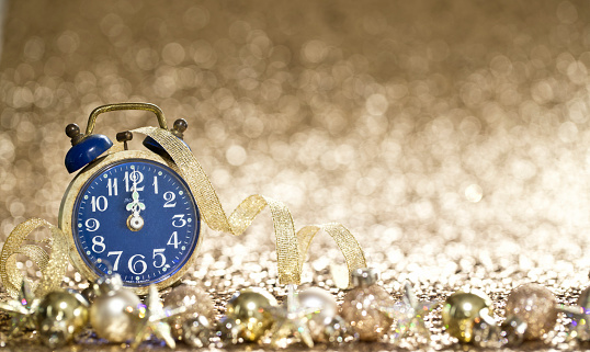 New Year's Celebration with Vintage Alarm Clock. 2021 on Gold Background