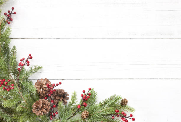 istock Christmas pine garland border on an old white wood background 1282770164
