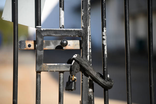 istock Close-up of a padlock on a gate 1282776254