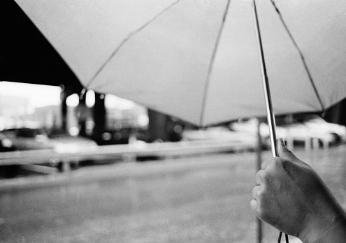Holding an umbrella