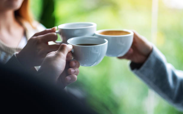 istock A group of young people enjoyed drinking and clinking coffee cups 1282778834