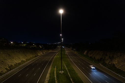 A cool timelapse shot of a highway road at night