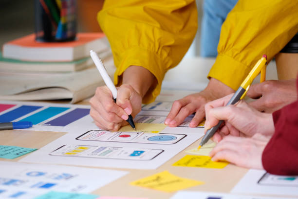 istock Brainstorm planing creative asian teamwork, Group of asia mobile phone app developer team meeting for ideas about screen display prototype smartphone layout, ux startup small business, top view 1282781396