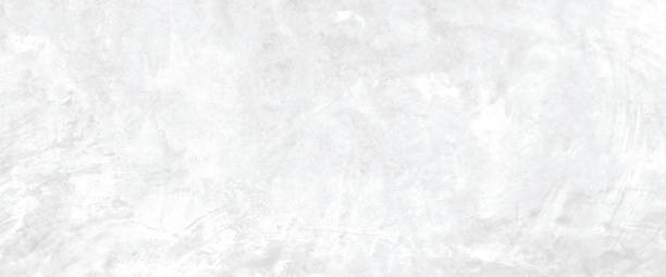 istock White concrete stone paint wall background, Grunge cement paint texture backdrop, White rough concrete stone wall background, Copy space for interior design background, banner, wallpaper 1282781402