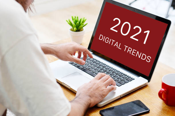 istock Man hand typing laptop computer with 2021 digital marketing trends on screen background, digital marketing, business and technology concept 1282781490