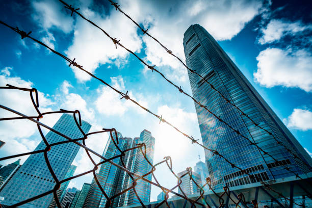 istock Cityscape outside barbed wire fence 1282792007