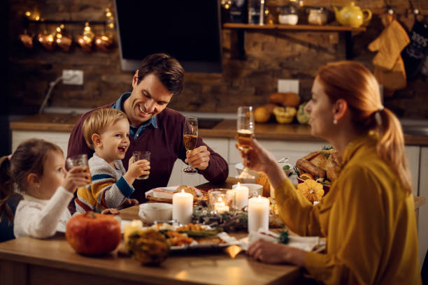 istock Happy family having fun during Thanksgiving dinner at dining table. 1282792422