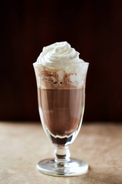 istock Coffee with whipped cream on bright stone background. Soft focus. Close up. 1282793743