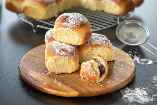 istock Sweet bread rolls with cherri filling and powdered sugar on top 1282793926