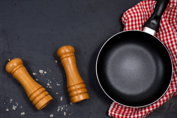istock Empty black frying pan or skillet with pepper and sea salt 1282799215