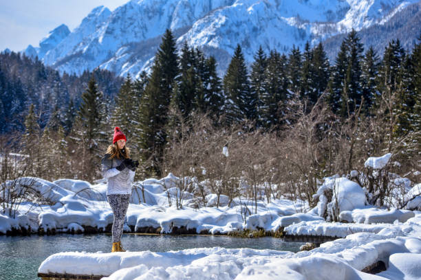 istock Photographer taking photos near spring lake 1282800678